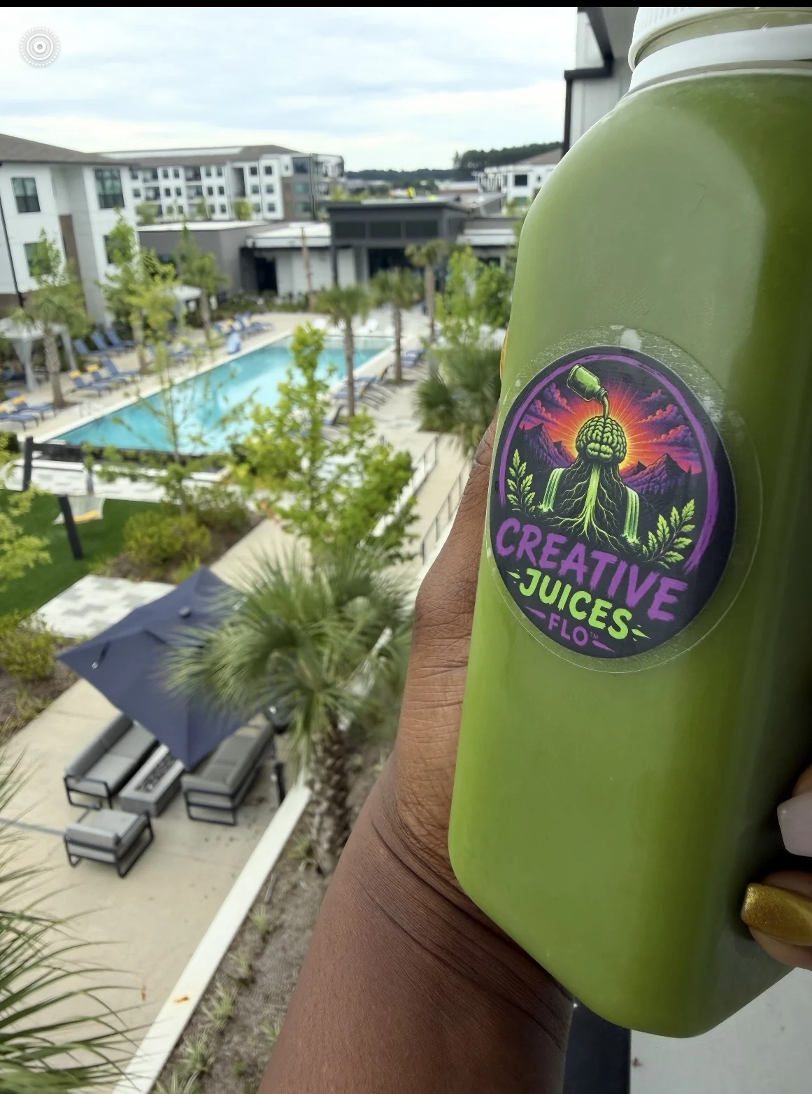Live green juice photo by pool view